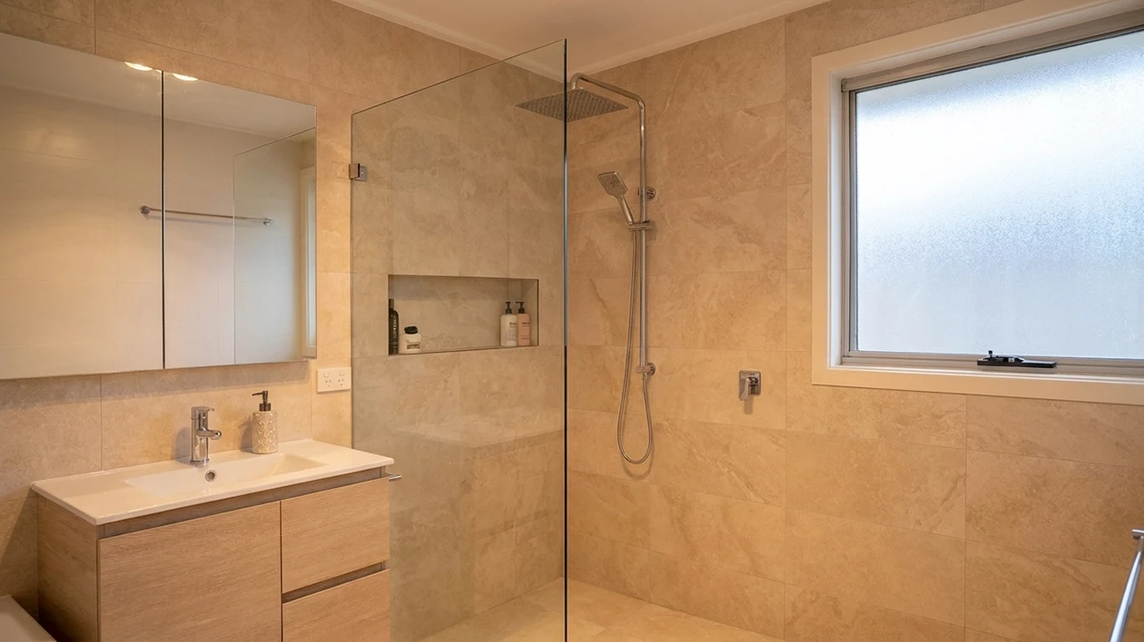 Small bathroom with large-format wall and floor tiles